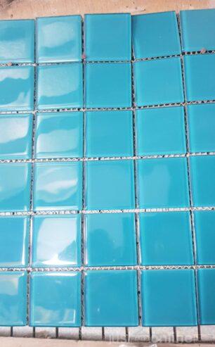 Sky blue mosaic tiles for swimming pool .