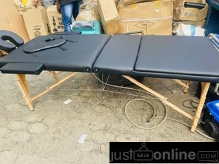 Wood foldable massage/facial bed for sale at tradefair