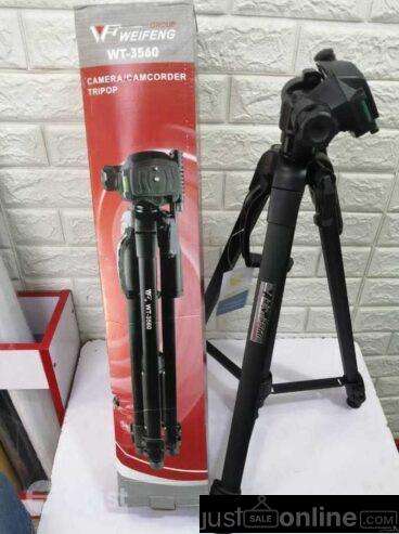 Camera tripod stand for sale at trade fair market