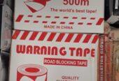 Caution tape for sale at trade fair market