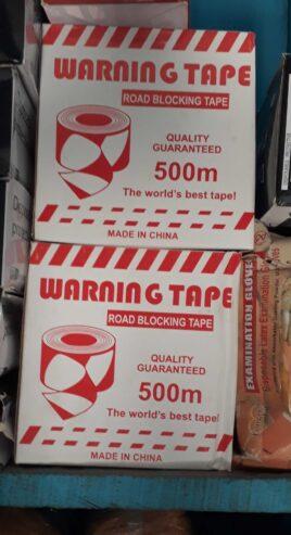 Caution tape for sale at trade fair market