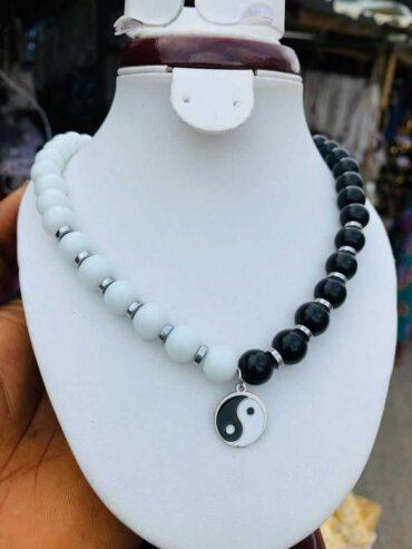 Yin-yang neck bead for sale at tradefair market