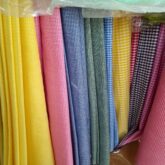 Plain uniform material for sale at suru alaba market