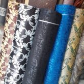 Curtains in different design for sale at trade fair market